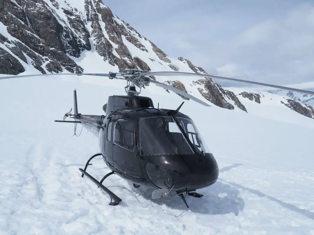 adrenaline junkie bucket list - helicopter landing on Tasman Glacier, New Zealand
